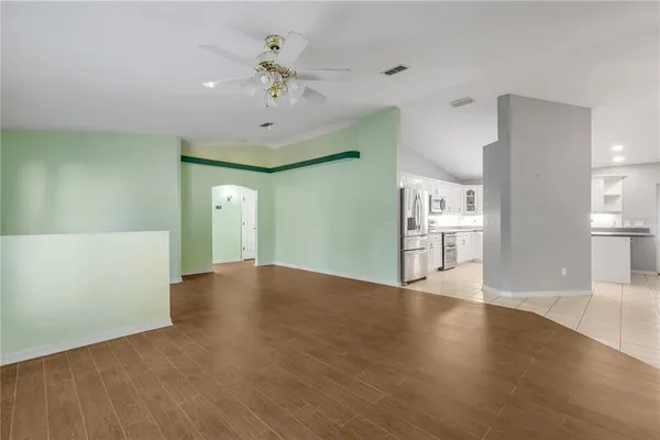 a view of a livingroom with a kitchen