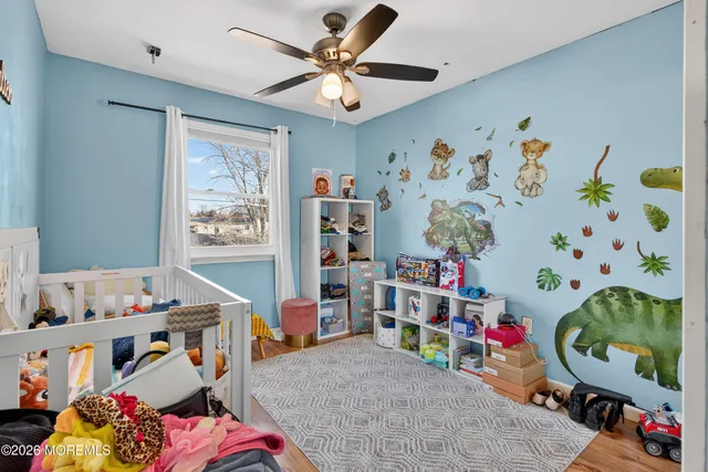 a bedroom with baby toys and a dining table