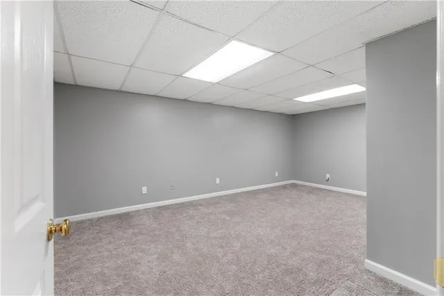 a bathroom with a toilet sink and shower