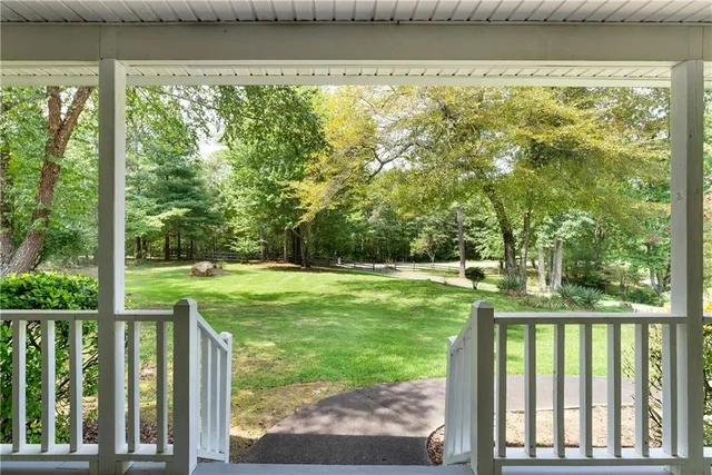 a view of balcony with wooden floor