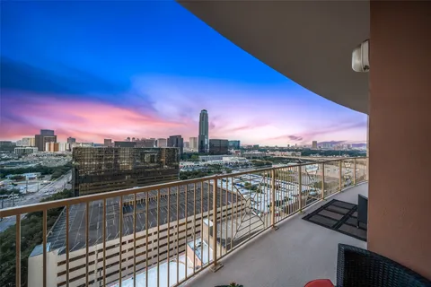 a view of a city skyline from a balcony