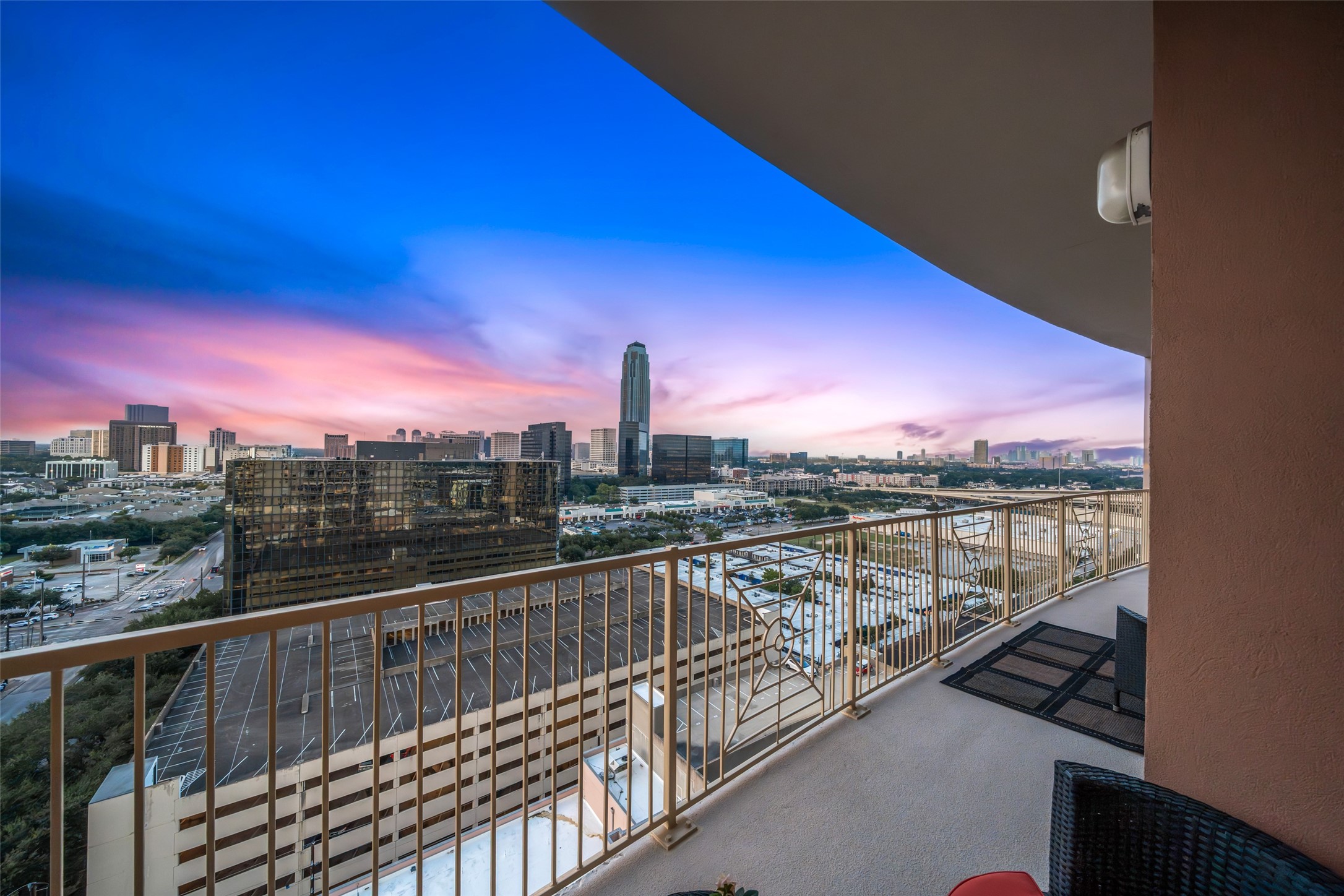 3505 Sage Road, Unit 1705 Houston, TX 77056 - Photo 13 of 38 a view of a balcony with wooden floor and city view