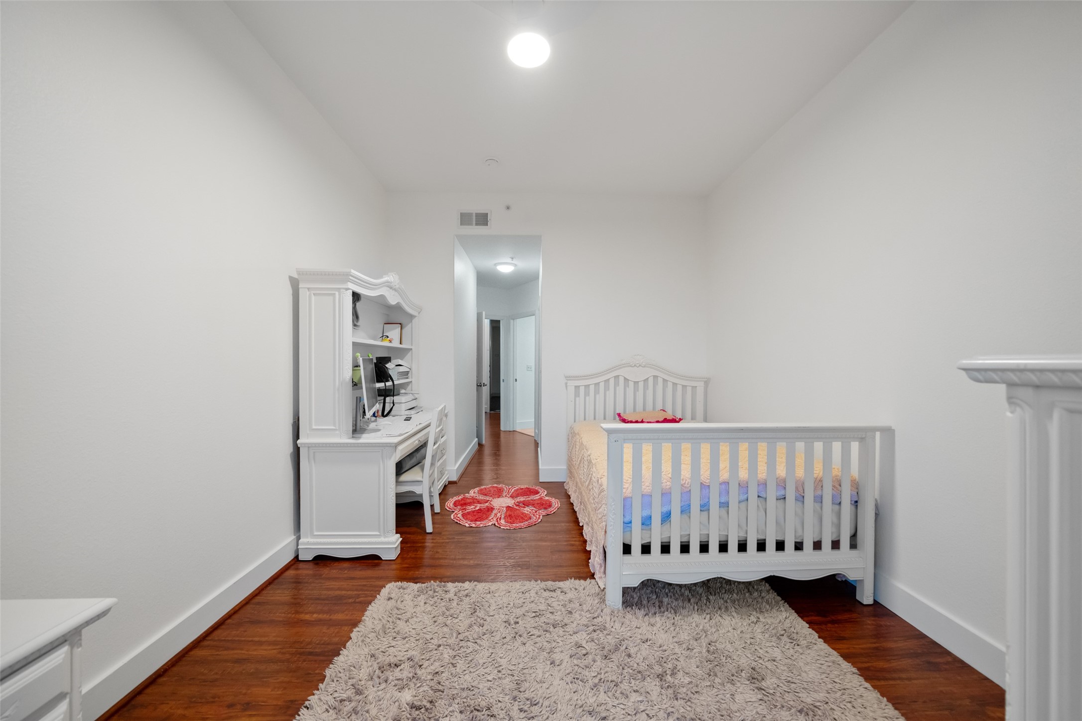 3505 Sage Road, Unit 1705 Houston, TX 77056 - Photo 16 of 38 a room with lots of white furniture and wooden floor