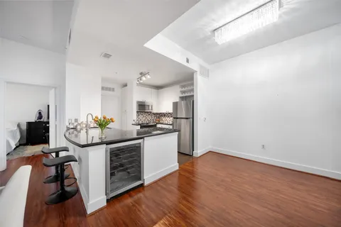 a kitchen with stainless steel appliances a stove top oven and sink