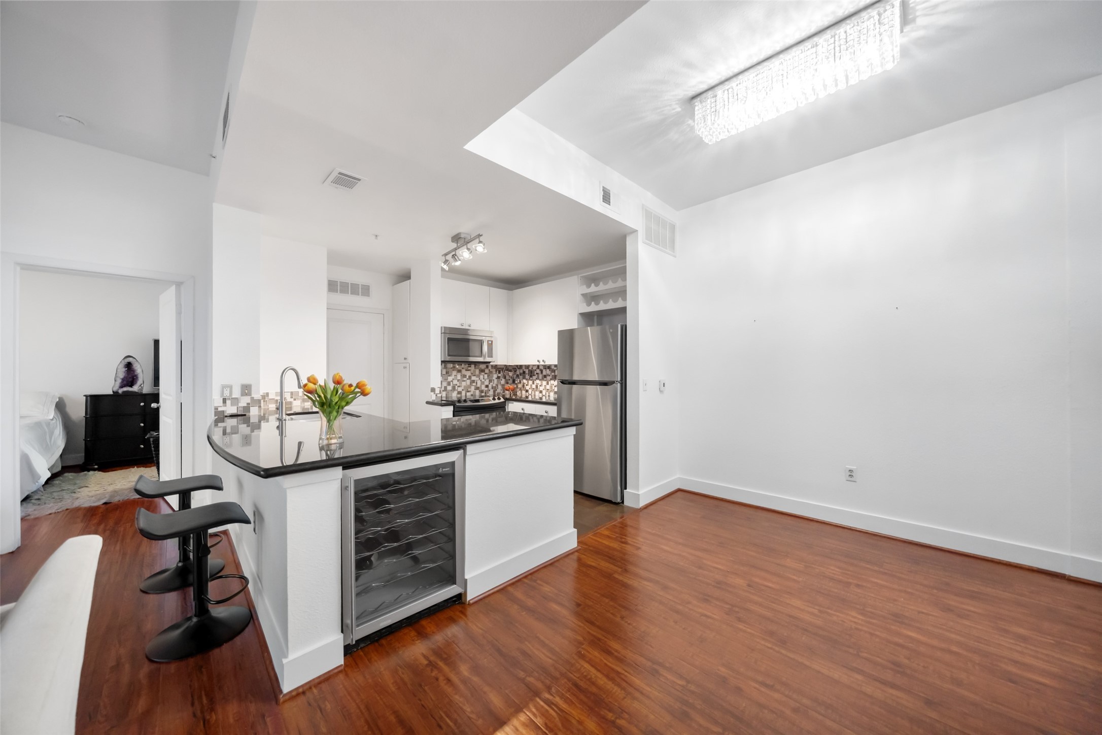 3505 Sage Road, Unit 1705 Houston, TX 77056 - Photo 24 of 38 a kitchen with stainless steel appliances granite countertop a sink and a stove top oven