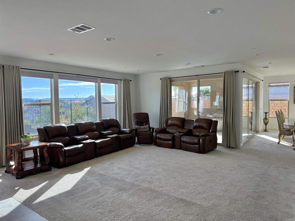 39529 Dayspring Way Temecula, CA 92591 - Photo 6 of 49 a living room with furniture and large windows