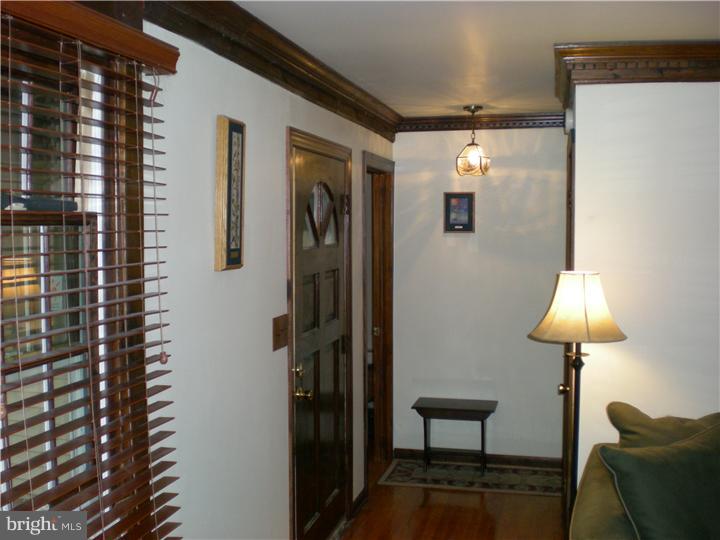 17 Center Road Pemberton, NJ 08068 - Photo 2 of 22 a view of a hallway with furniture and a window