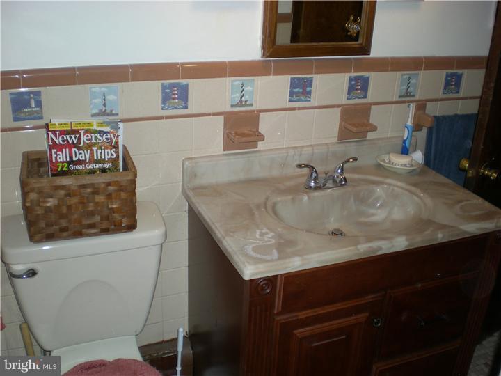 17 Center Road Pemberton, NJ 08068 - Photo 17 of 22 a bathroom with a sink and a toilet