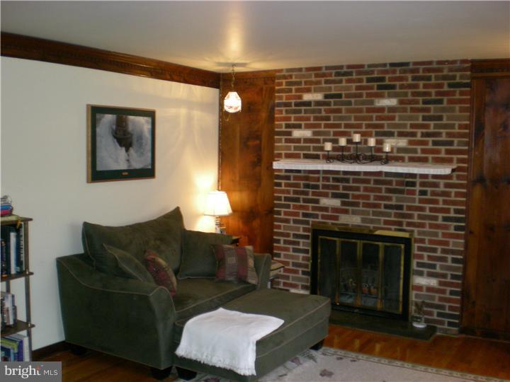 17 Center Road Pemberton, NJ 08068 - Photo 3 of 22 a living room with furniture and a fireplace