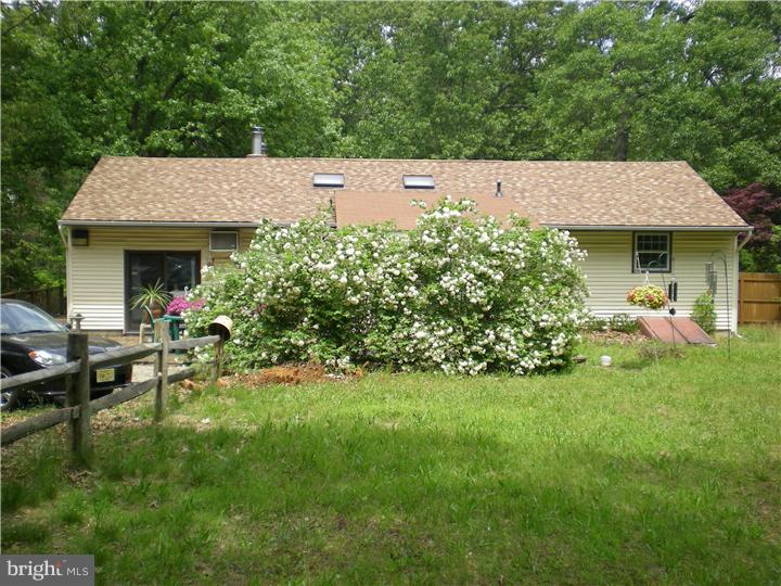 17 Center Road Pemberton, NJ 08068 - Photo 21 of 22 a backyard of a house with table and chairs