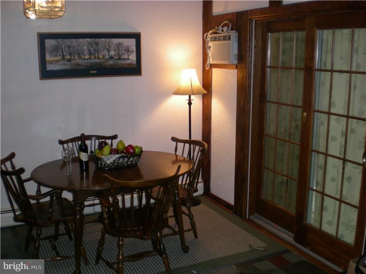 17 Center Road Pemberton, NJ 08068 - Photo 7 of 22 a view of a dining room with furniture and wooden floor