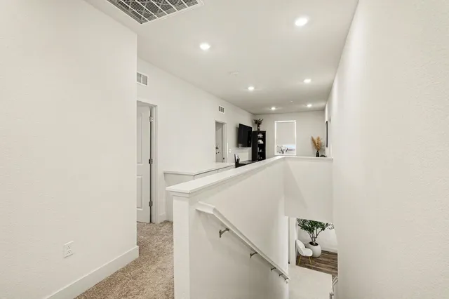 a view of kitchen with furniture and white wall