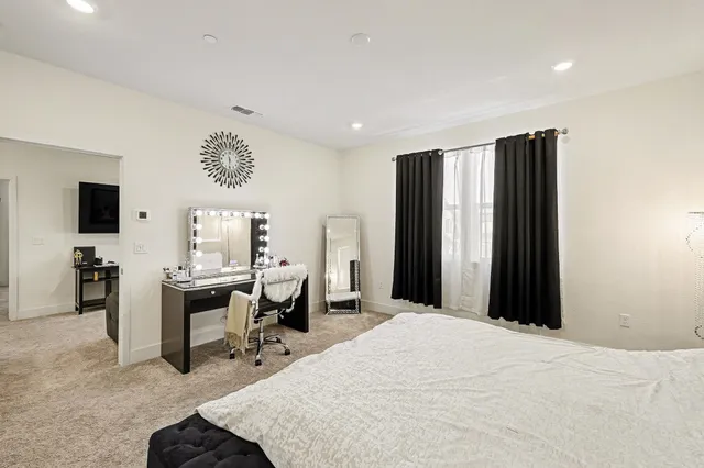 a bedroom with a bed and furniture