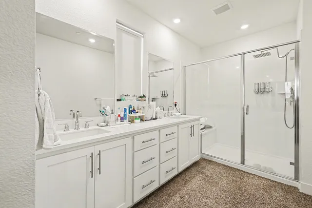 a view of a hallway with closet and a window