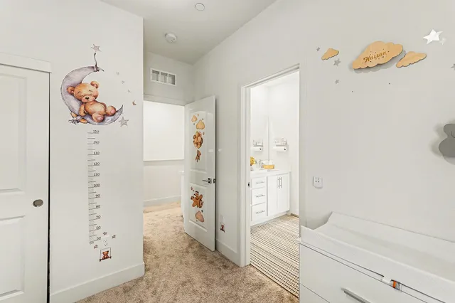 a bathroom with double sink and a mirror