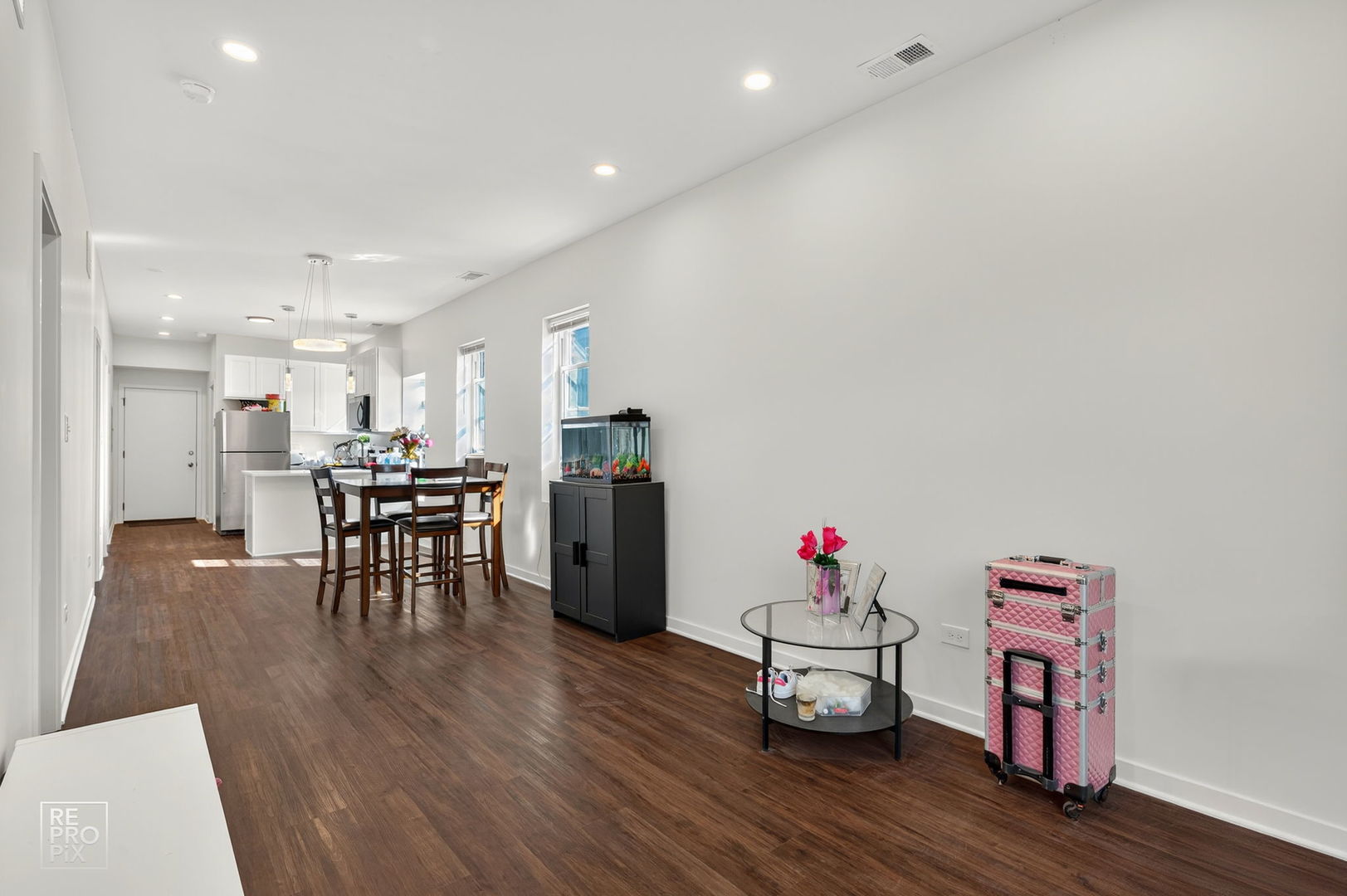 1624 West Pershing Road Chicago, IL 60609 - Photo 12 of 28 a living room with furniture and a wooden floor