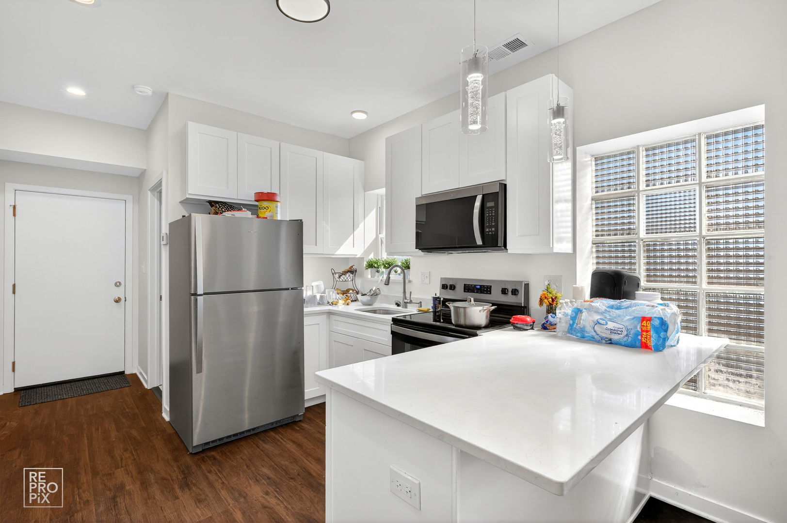 1624 West Pershing Road Chicago, IL 60609 - Photo 13 of 28 a kitchen with stainless steel appliances a refrigerator sink and microwave