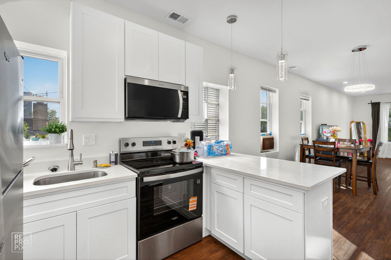 1624 West Pershing Road Chicago, IL 60609 - Photo 14 of 28 a kitchen with a sink stove and microwave