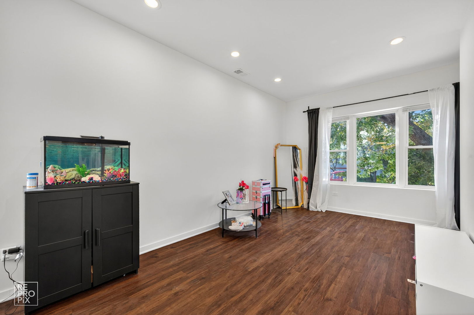 1624 West Pershing Road Chicago, IL 60609 - Photo 16 of 28 a living room with furniture and a window