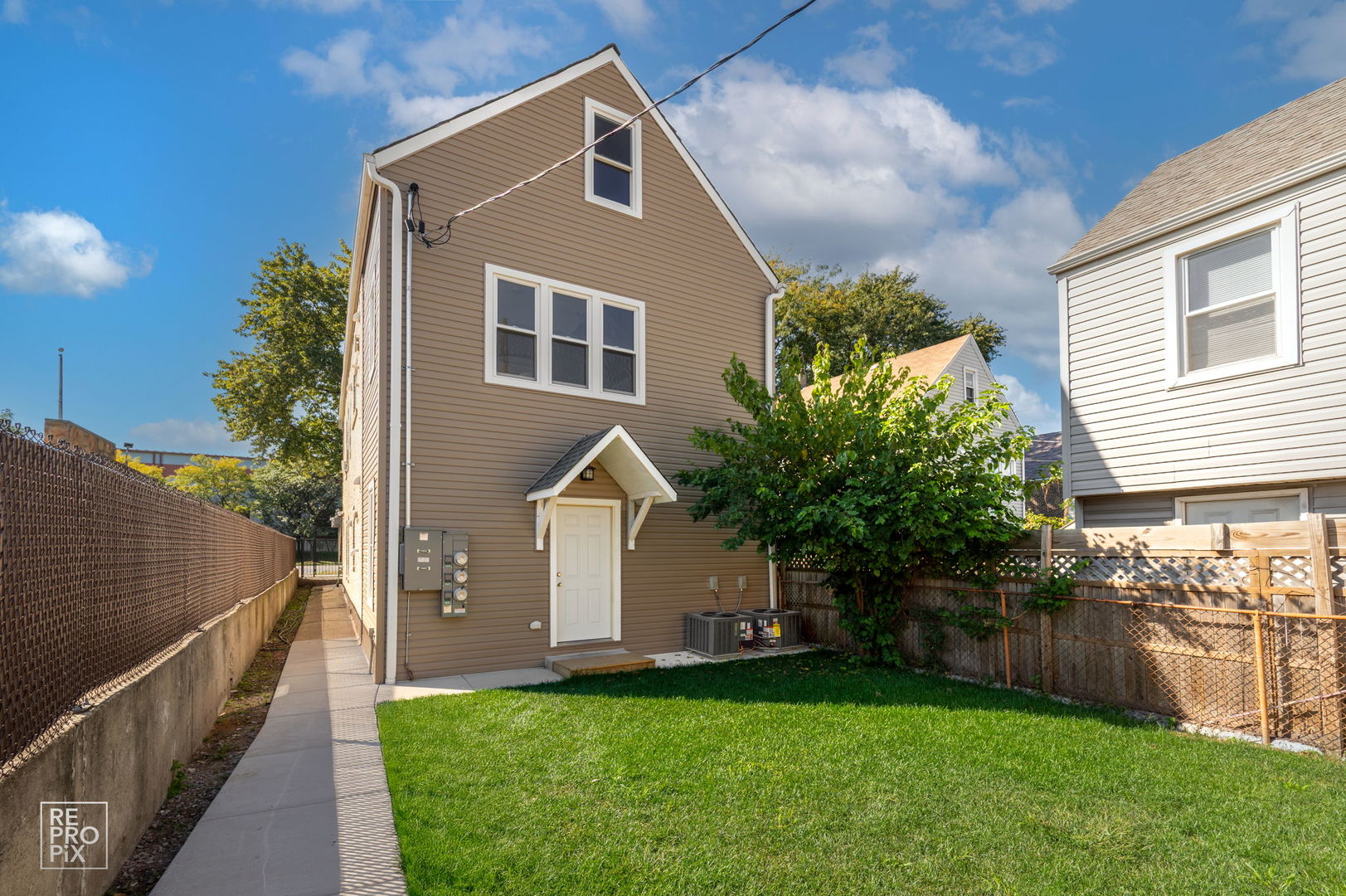 1624 West Pershing Road Chicago, IL 60609 - Photo 22 of 28 a front view of a house with a garden