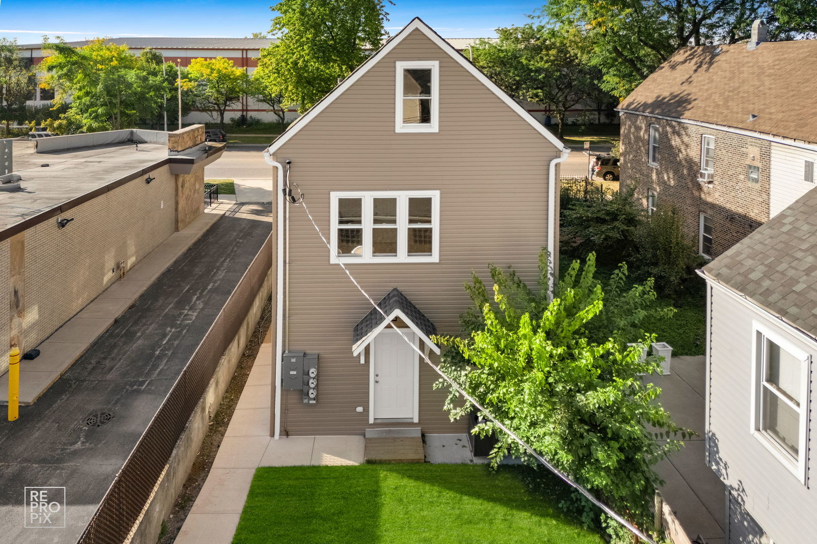 1624 West Pershing Road Chicago, IL 60609 - Photo 23 of 28 a view of a house with backyard and garden