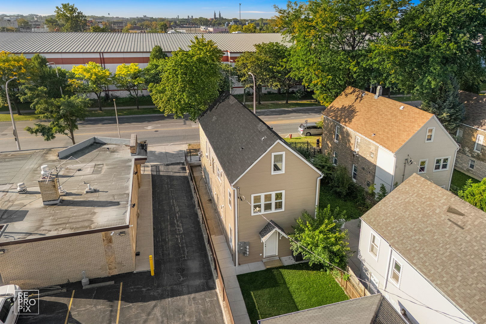 1624 West Pershing Road Chicago, IL 60609 - Photo 24 of 28 a aerial view of a house with a yard and lake view
