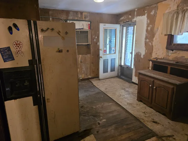 a bathroom with a shower and a sink