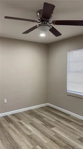 a view of a room with rack and wooden floor