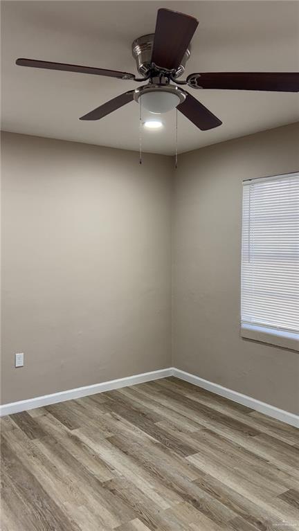 106 North 17th Street, Unit 23 Donna, TX 78537 - Photo 3 of 5 a view of a room with rack and wooden floor
