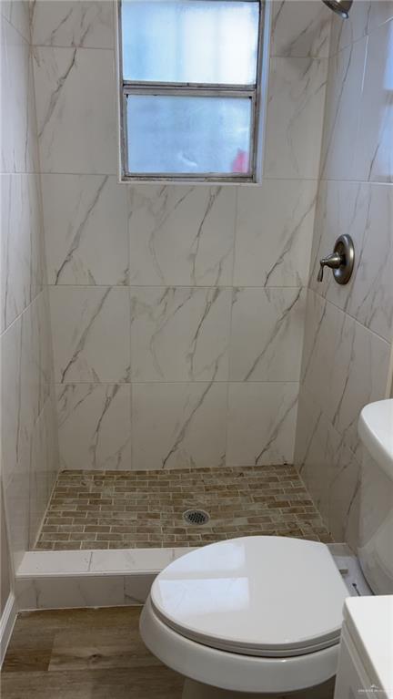 106 North 17th Street, Unit 23 Donna, TX 78537 - Photo 4 of 5 a bathroom with a toilet and a mirror