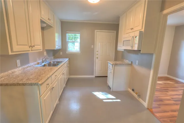 a bathroom with a sink a vanity and a mirror