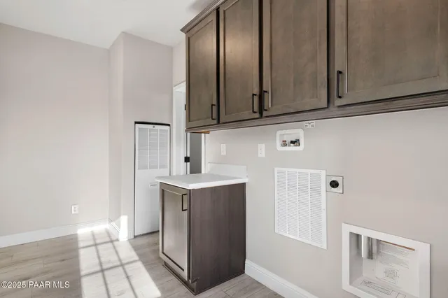 a view of cabinets with wooden floor
