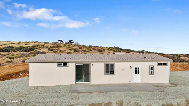 an aerial view of residential houses with city view