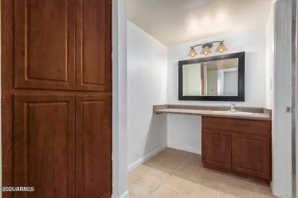 a bathroom with a sink and a mirror