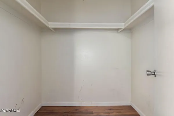 a view of a room with wooden floor