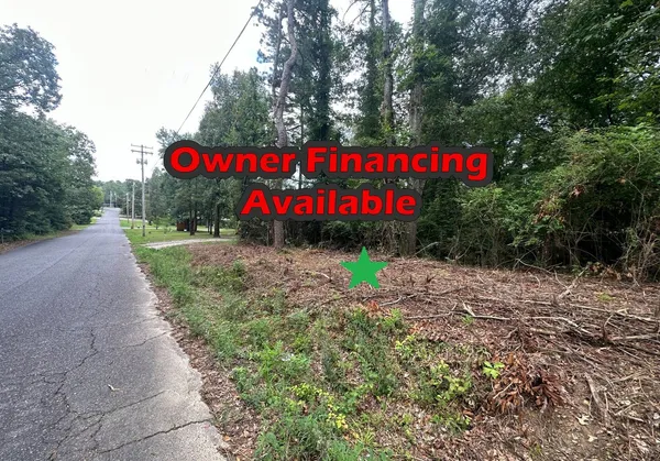 a sign that is sitting on a sidewalk