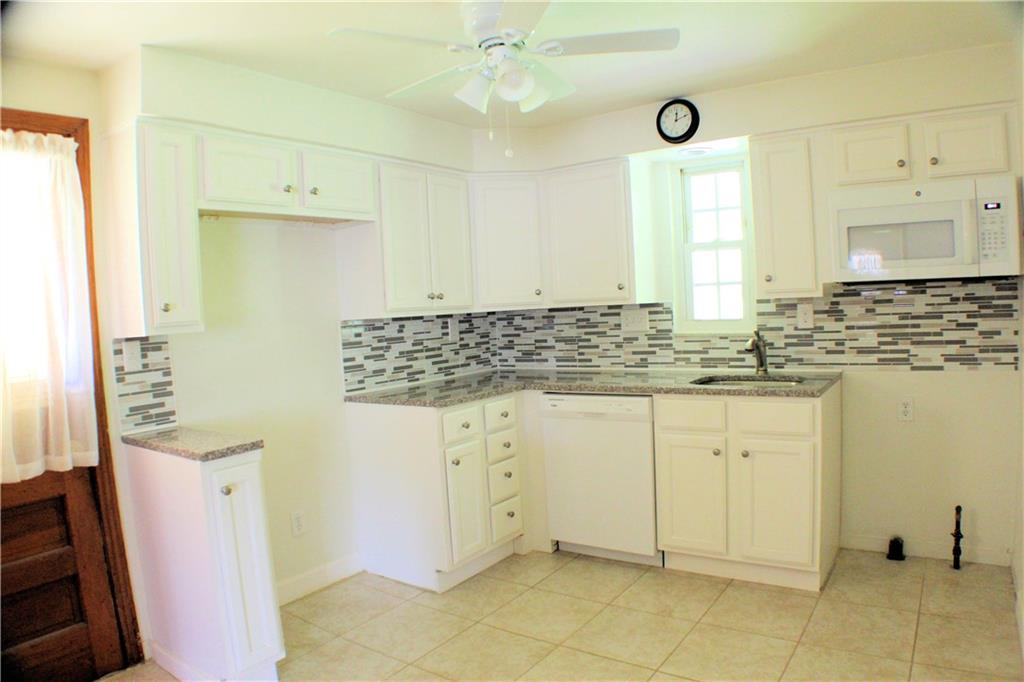1533 Cathell Road Pittsburgh, PA 15236 - Photo 5 of 25 11 x 10 New Eat-in Kitchen with Granite Countertops, Ceramic Tile Floor, New Dishwasher & Microwave
