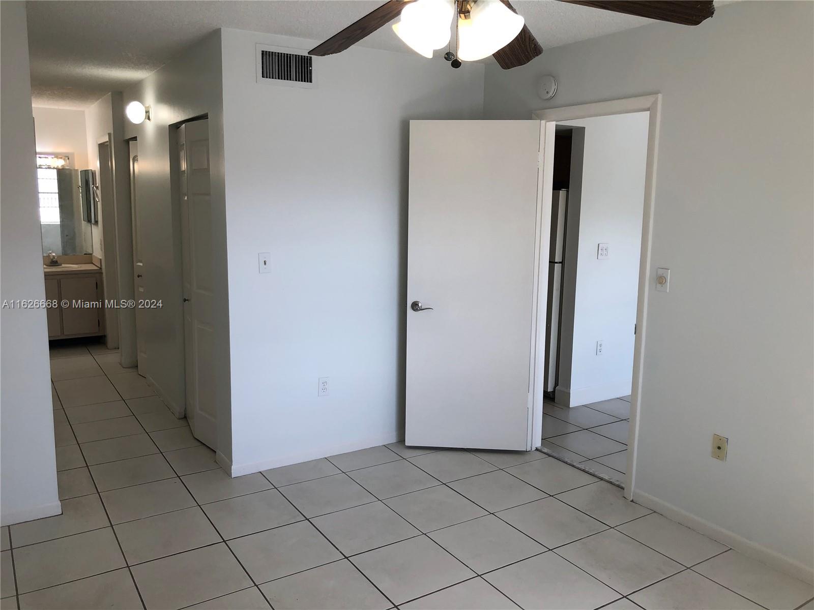 6901 Southwest 129th Avenue, Unit 5 Miami, FL 33183 - Photo 16 of 19 a view of a hallway