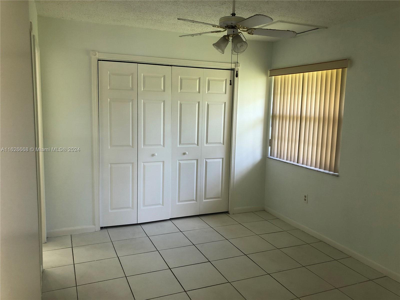 6901 Southwest 129th Avenue, Unit 5 Miami, FL 33183 - Photo 17 of 19 an empty room with windows