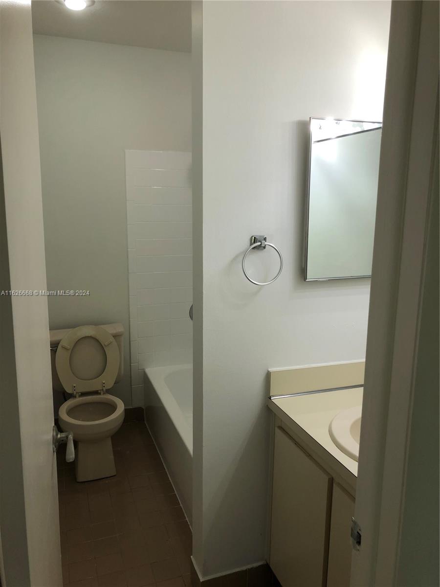 6901 Southwest 129th Avenue, Unit 5 Miami, FL 33183 - Photo 18 of 19 a bathroom with a sink and a toilet
