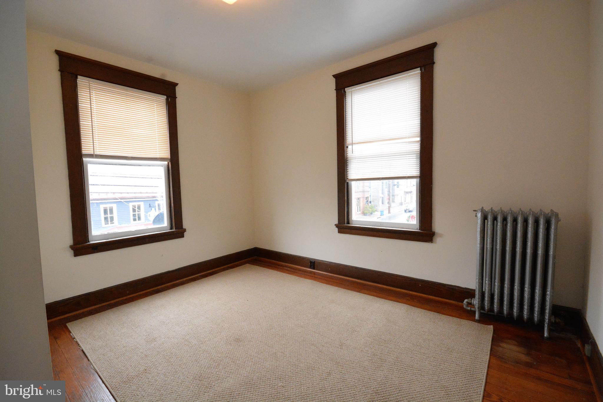5 West Main Street, Unit 4 Middletown, MD 21769 - Photo 4 of 9 an empty room with a window