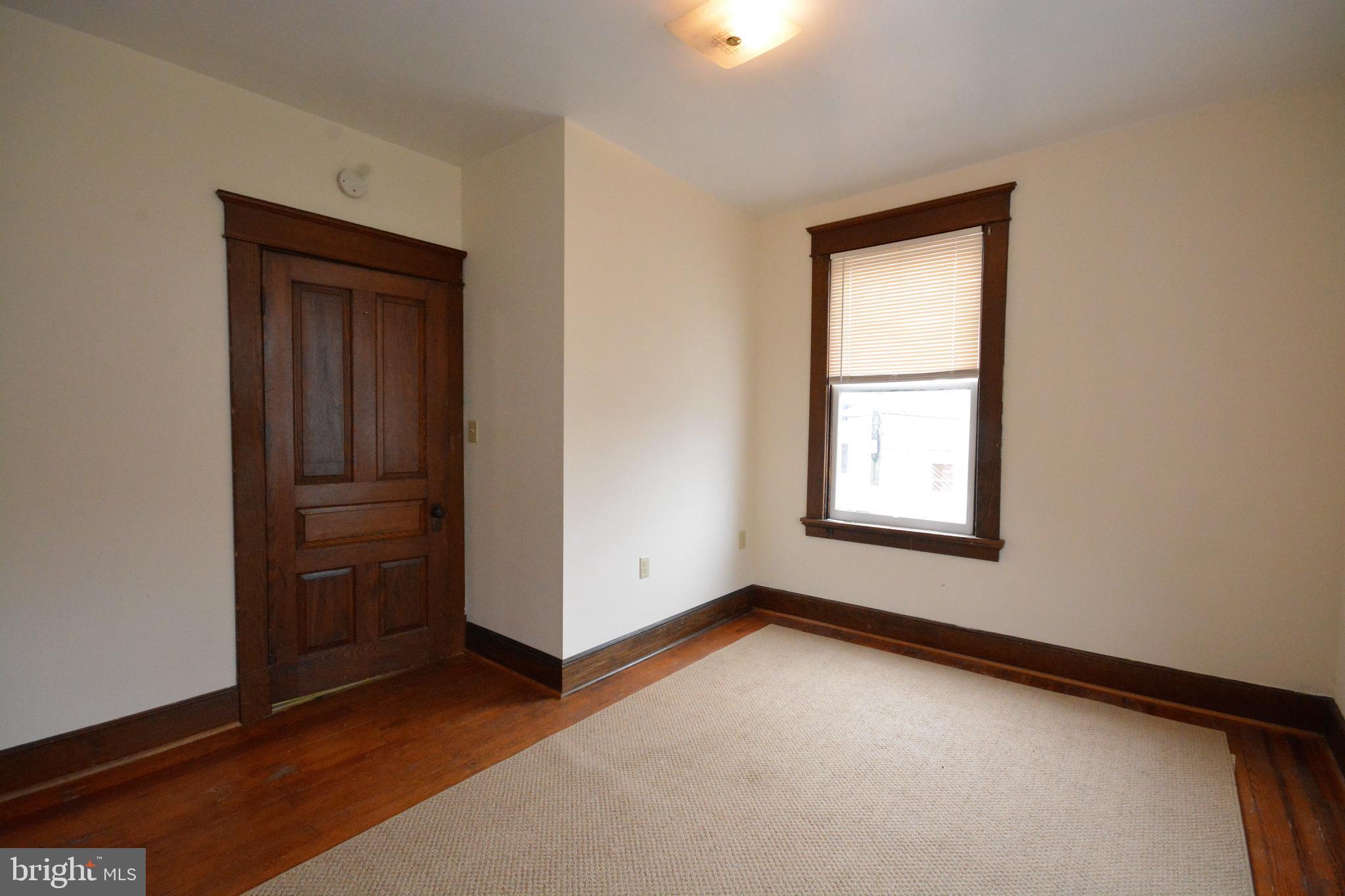 5 West Main Street, Unit 4 Middletown, MD 21769 - Photo 5 of 9 an empty room with windows