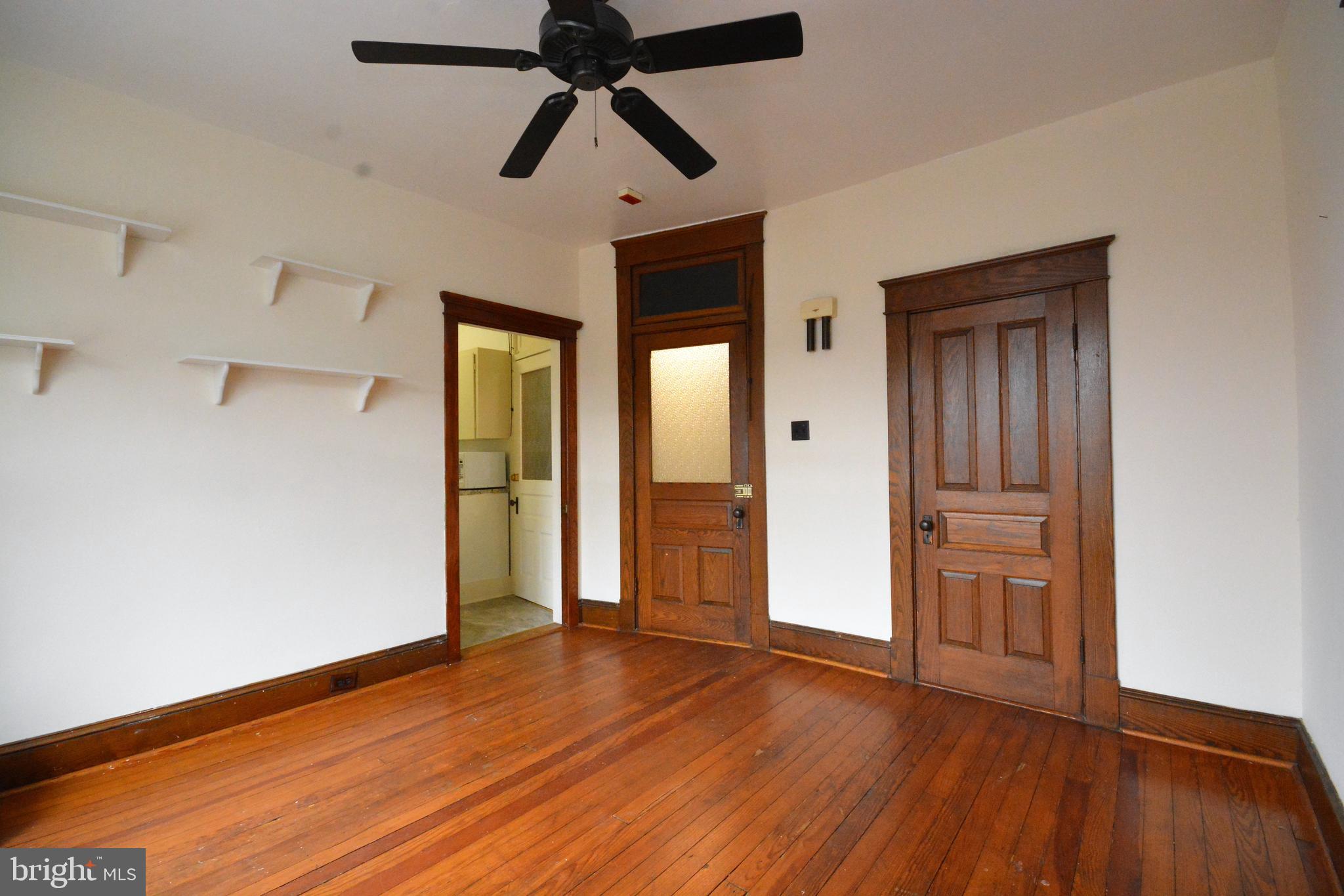 5 West Main Street, Unit 4 Middletown, MD 21769 - Photo 8 of 9 a view of empty room with wooden floor and fan