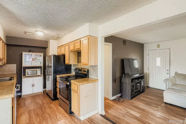 a view of a livingroom with furniture and a flat screen tv