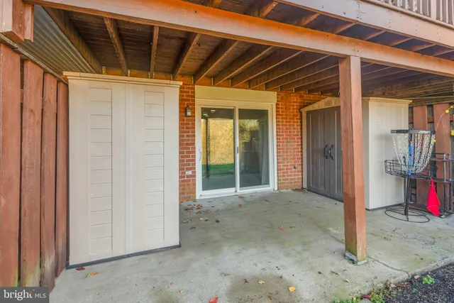 a view of a room with wooden walls