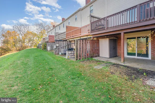 a view of a house with backyard and porch