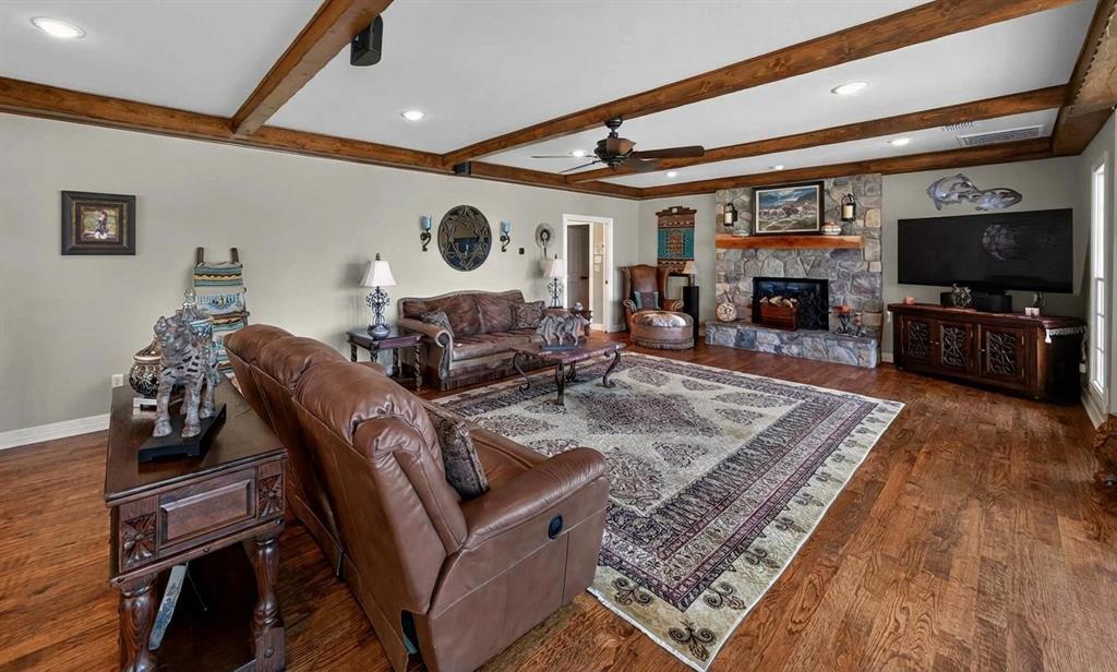 535 Riata Road Bullard, TX 75757 - Photo 14 of 40 a living room with furniture and a flat screen tv