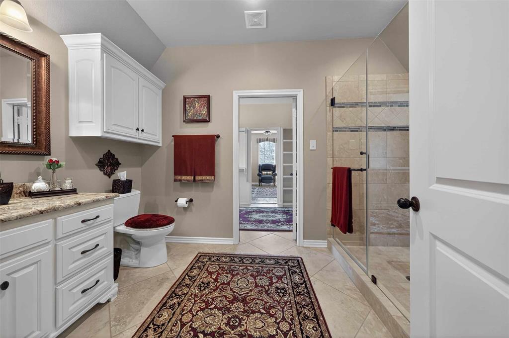535 Riata Road Bullard, TX 75757 - Photo 22 of 40 a bathroom with a sink and a toilet