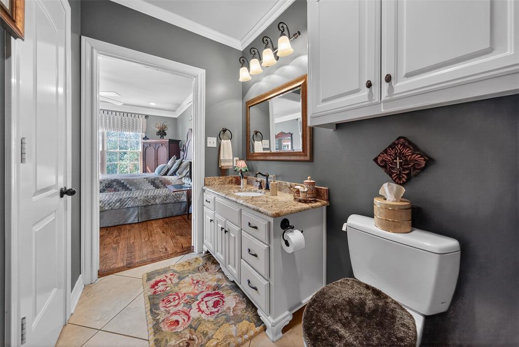 535 Riata Road Bullard, TX 75757 - Photo 24 of 40 a bathroom with a sink a toilet and shower