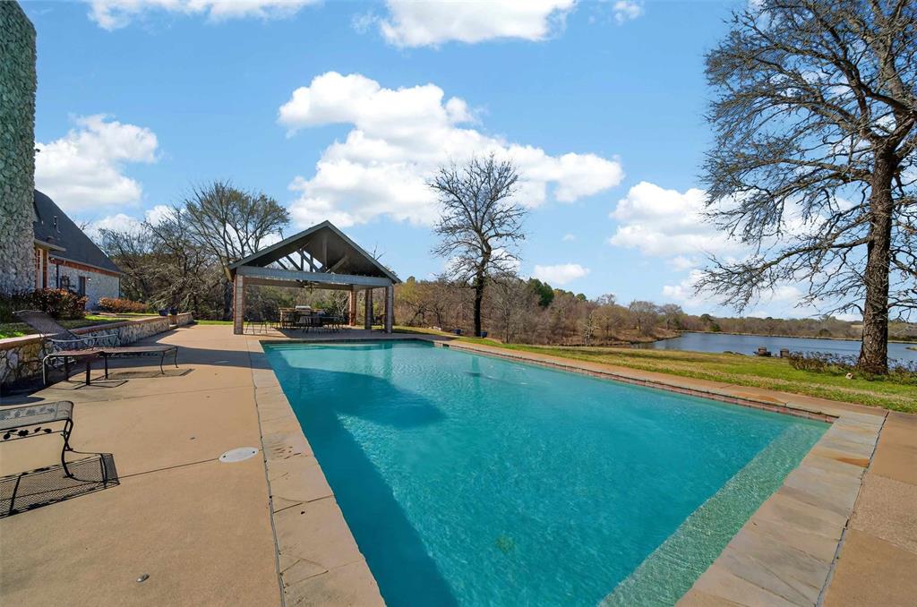 535 Riata Road Bullard, TX 75757 - Photo 27 of 40 a view of swimming pool with a table and chairs